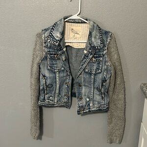 Denim jacket with knitted sleeves